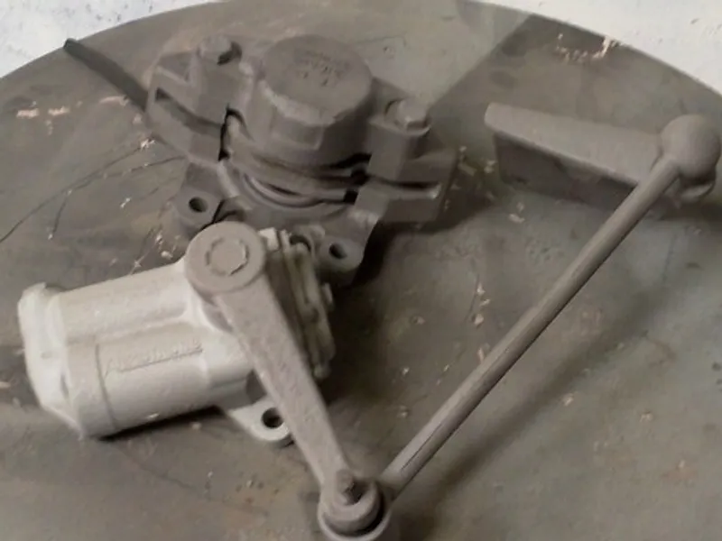 Heavy industrial machinery components after blasting