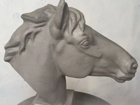 Cast iron horse sculpture after blasting