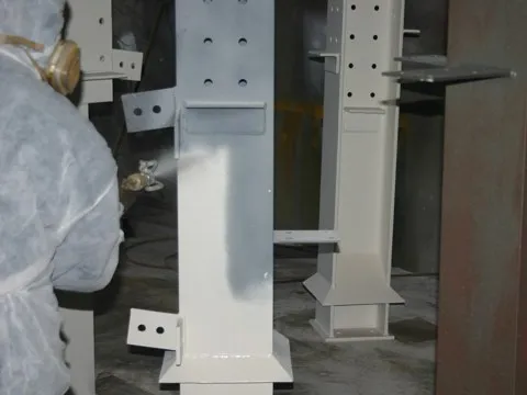 Airless paint spraying intumescent fire protection coating onto steelwork