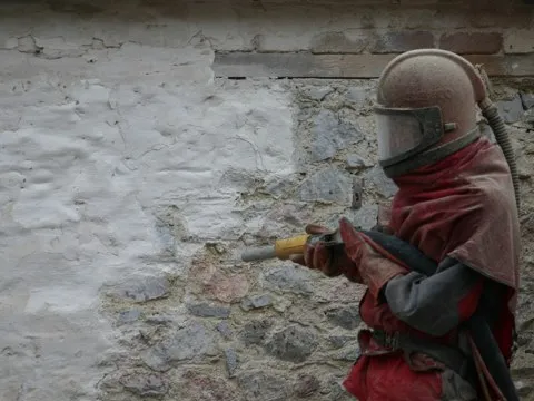 Concrete masonry coated with breathable protective paint