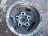 Heavily rusted steel wheel before blasting